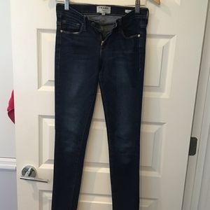 FRAME dark wash skinny jeans.